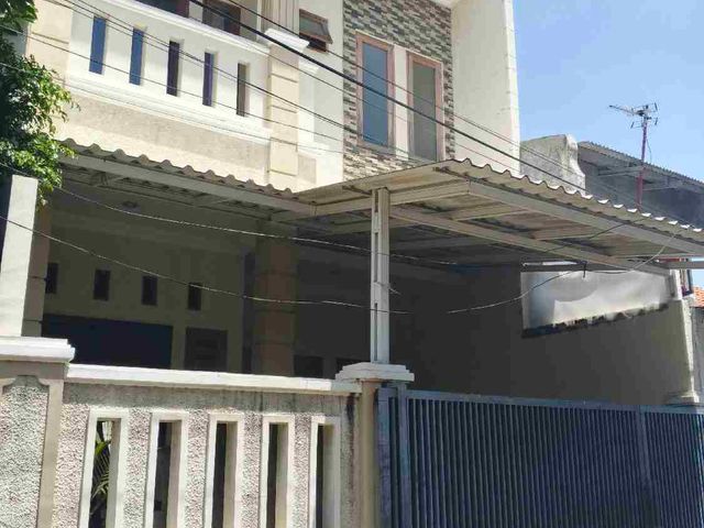 RUMAH MINIMALIS MODERN DI KOMPLEK ABADI DUREN SAWIT